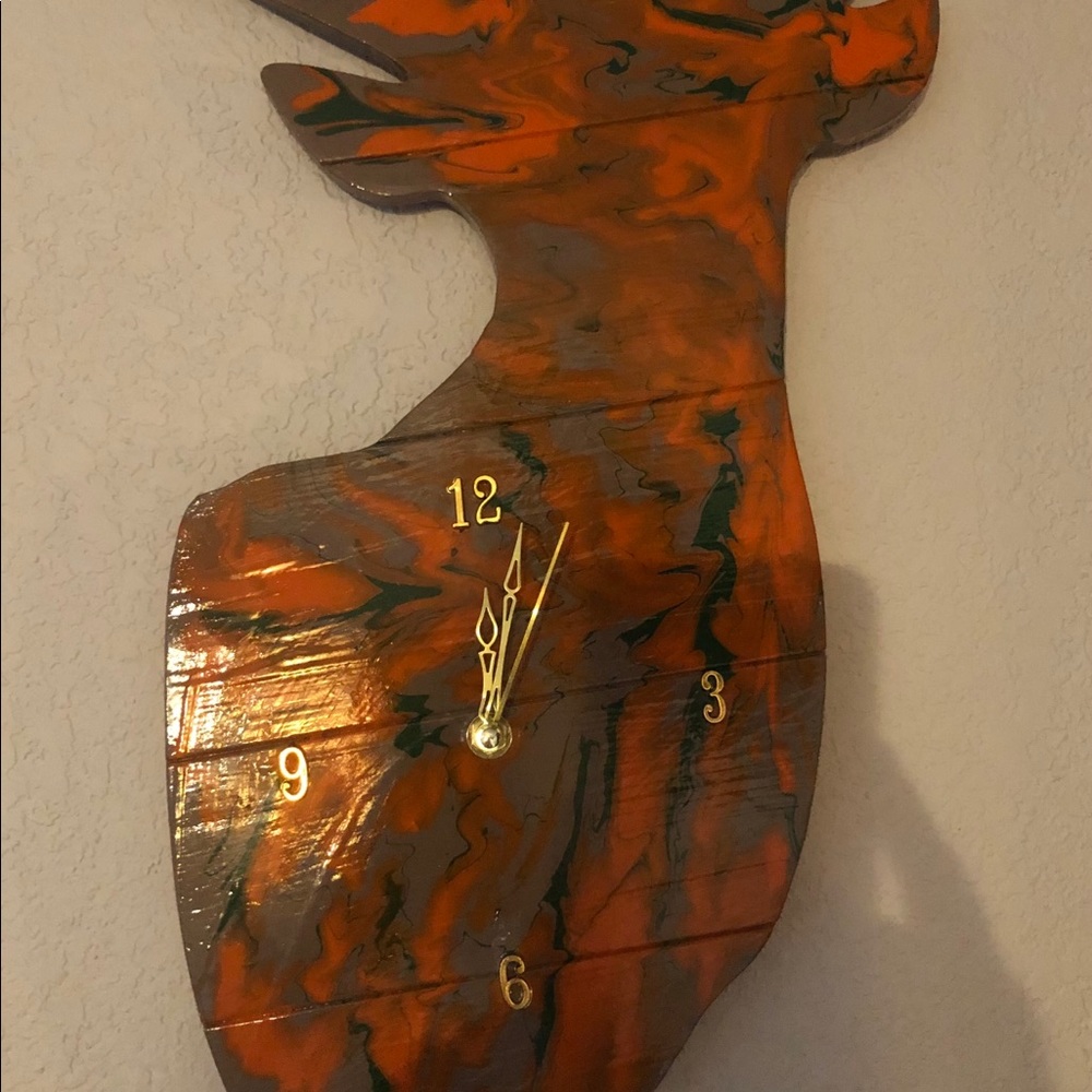 Wood deer cut out.  Made into a clock